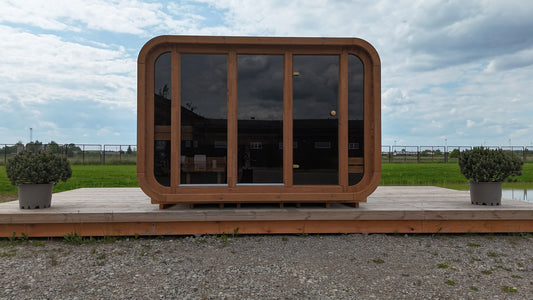 Ruutu 300 Comfort cube sauna on a terrace, full tinted glass front