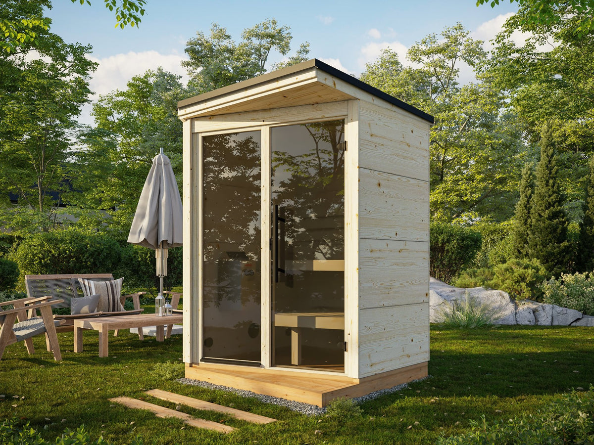 Kivi 150 compact garden sauna in a garden