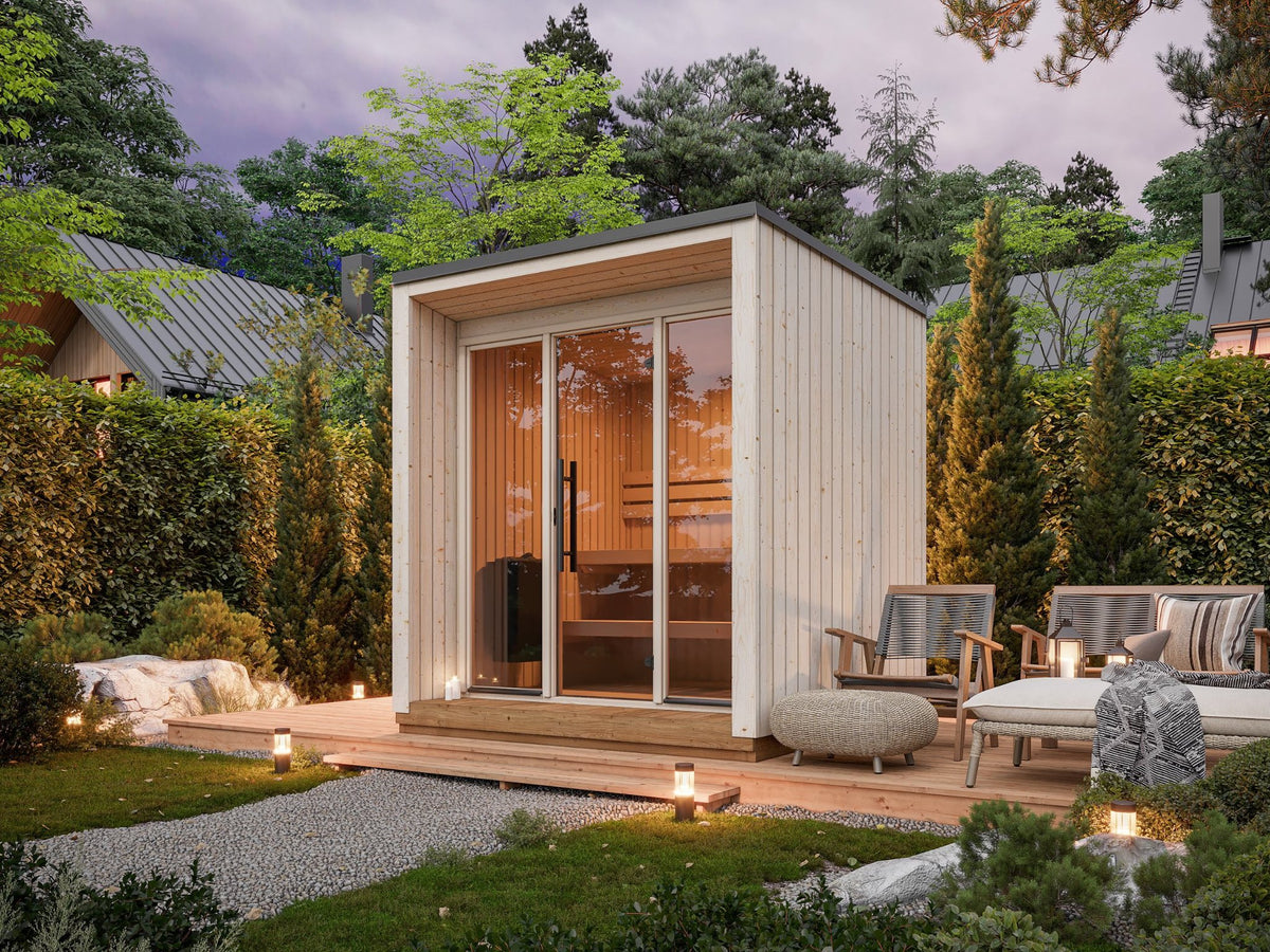 Meri 230 insulated garden sauna in a garden