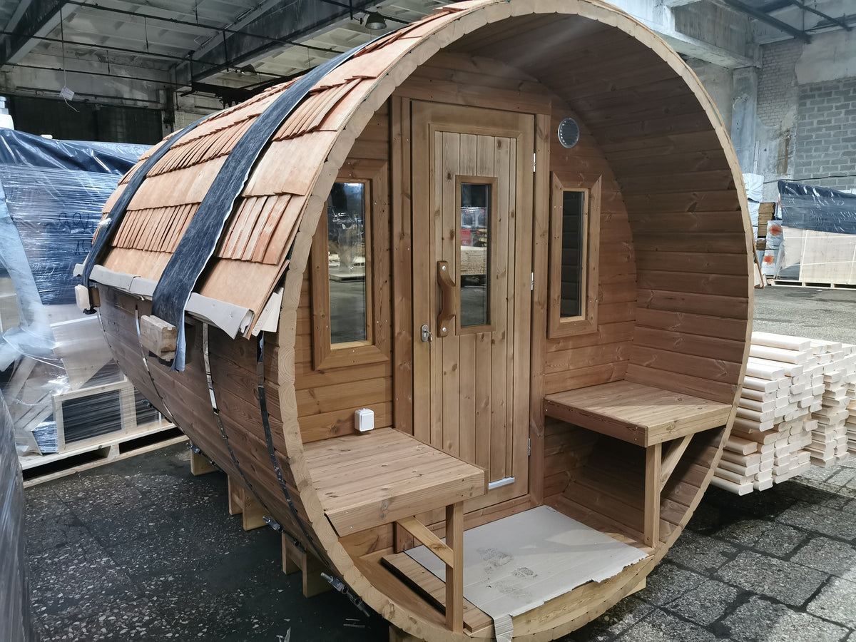 Holvi 300 Compact with the natural wooden shingle roof option and terrace benches