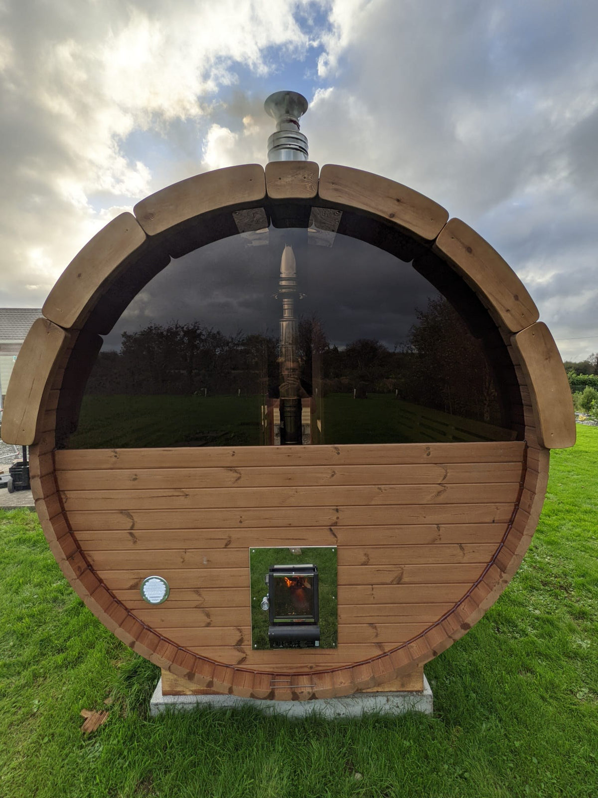 Holvi 400 back wall with the half glass panoramic option and outside fed wood stove