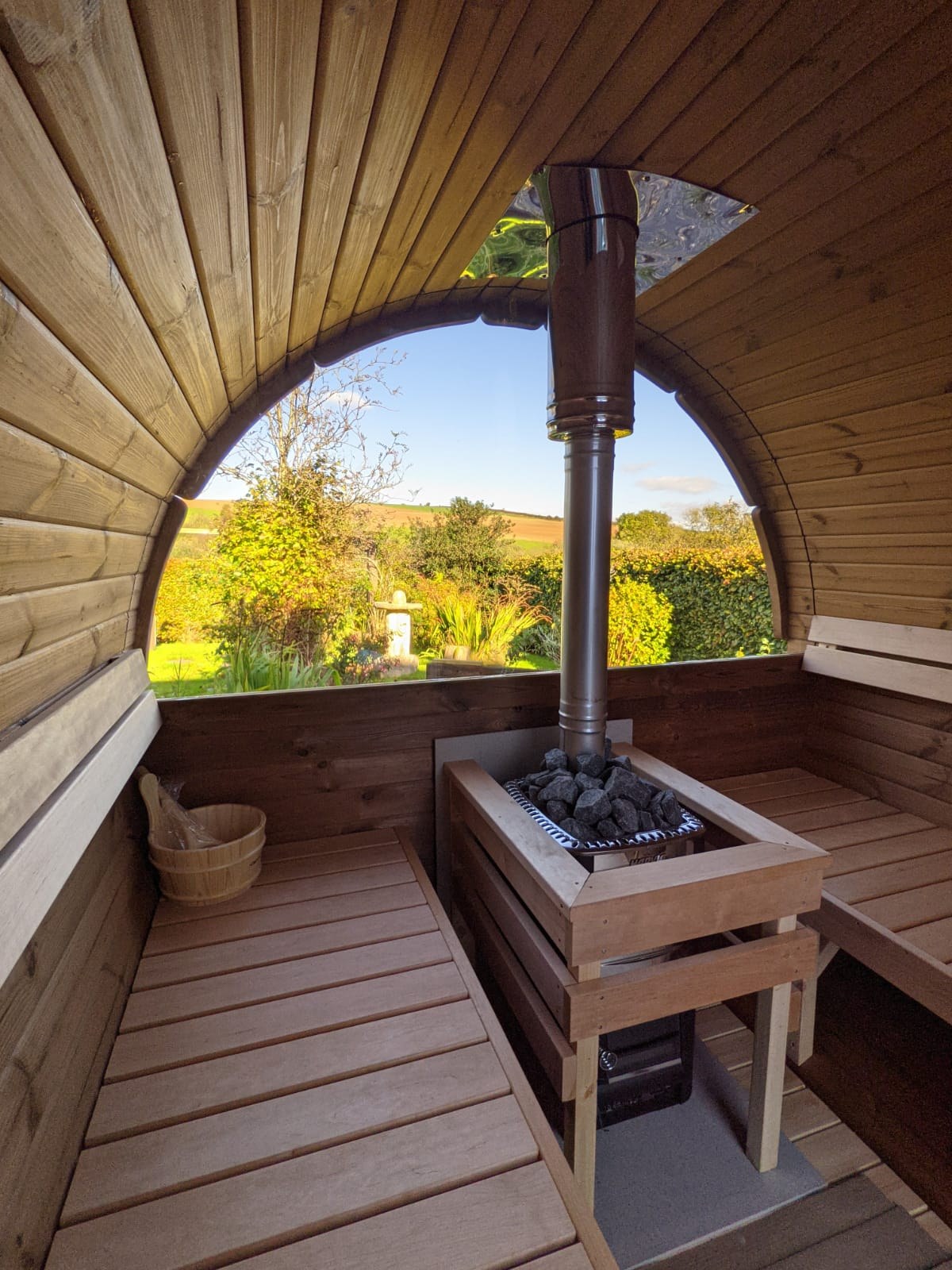 Holvi 300 Compact interior with wood fired stove and the half glass back wall option