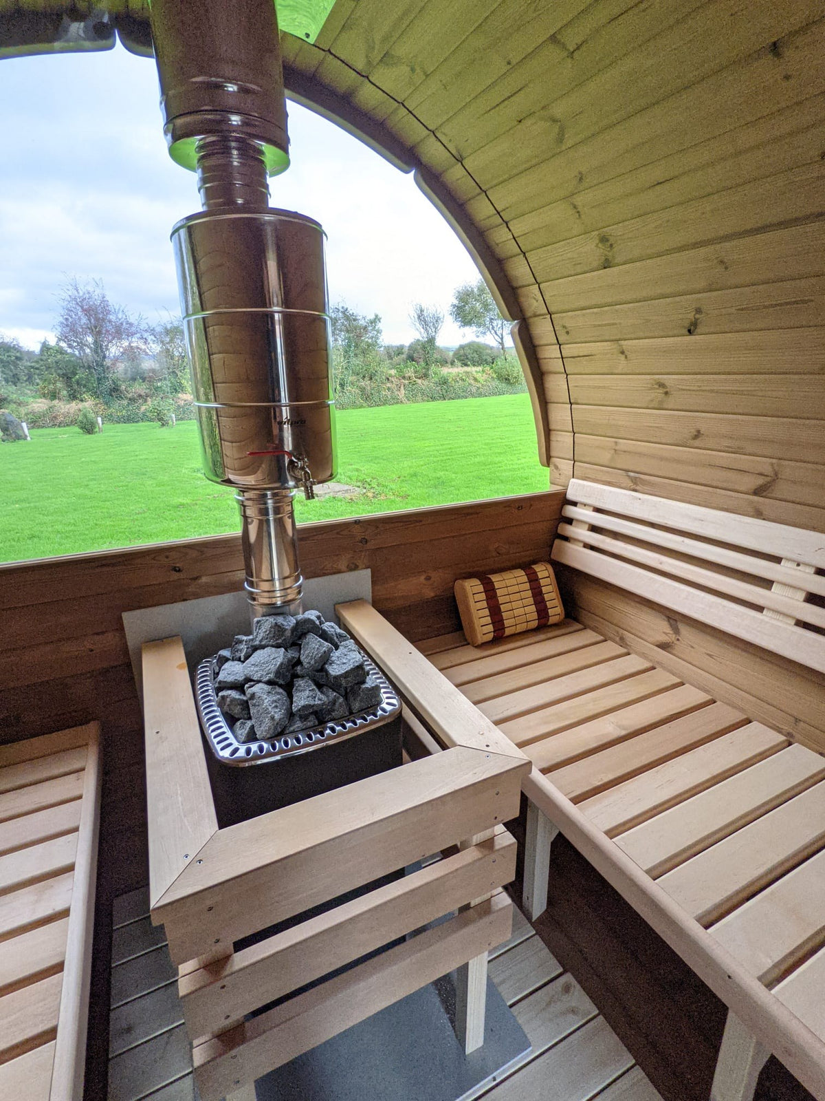 Holvi 400 hot room with wood fired stove and half glass back wall