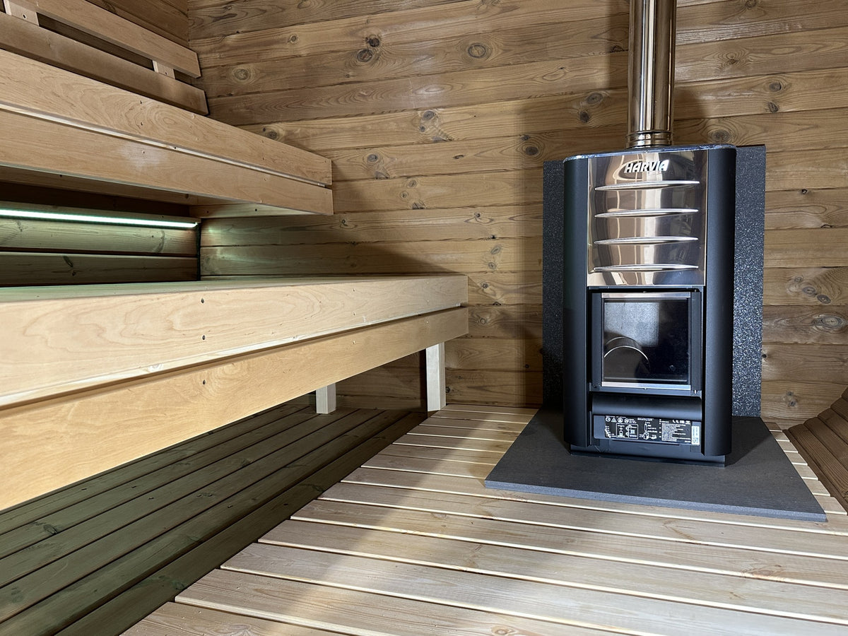 Ruutu 230 interior with the Harvia wood fired heater option