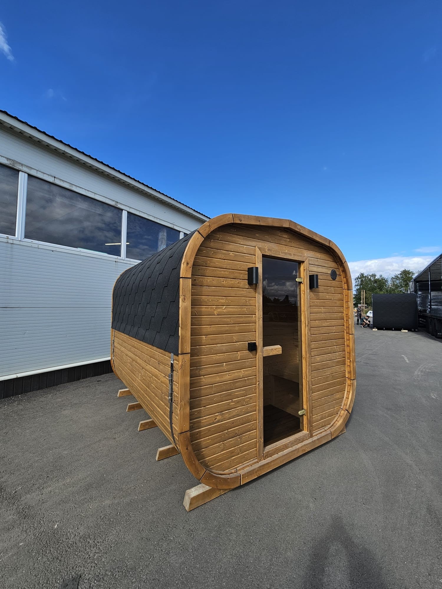 Cube Sauna 2m thermowood exterior against a clear blue sky