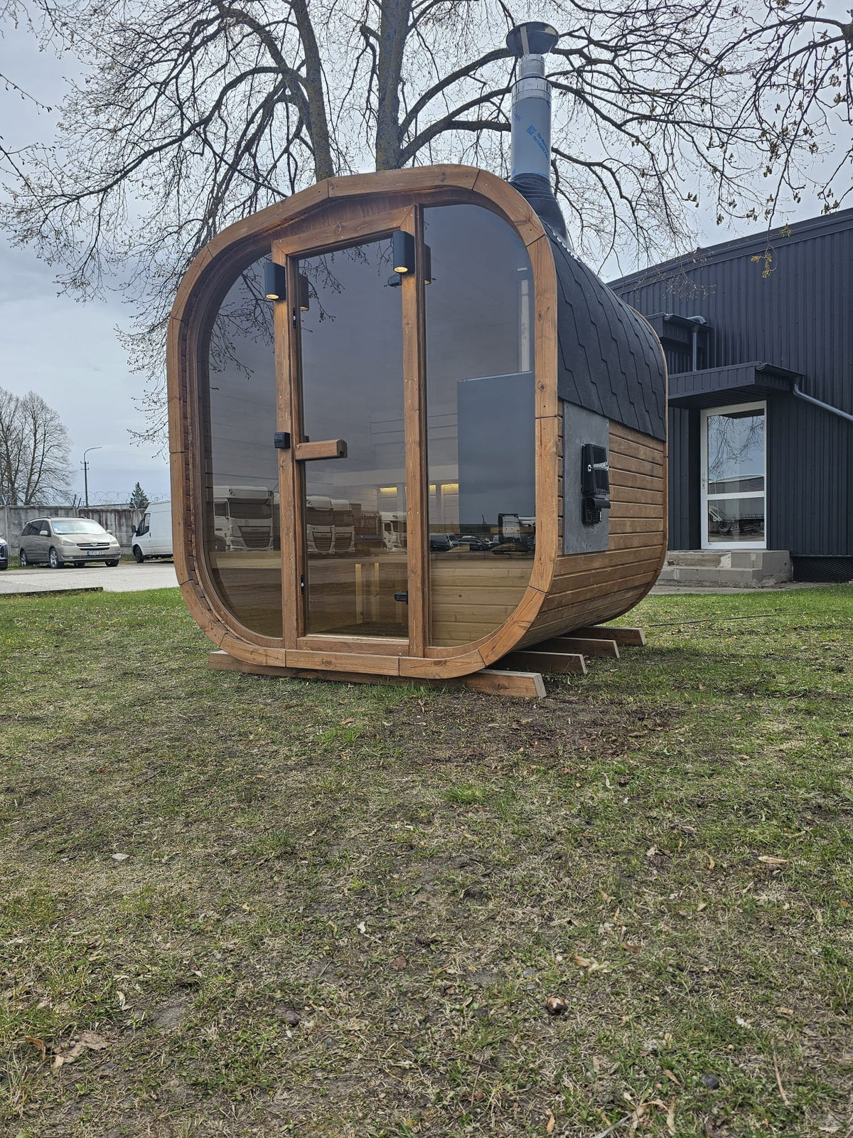 Cube Sauna 2m thermowood exterior in a garden setting, front three-quarter view