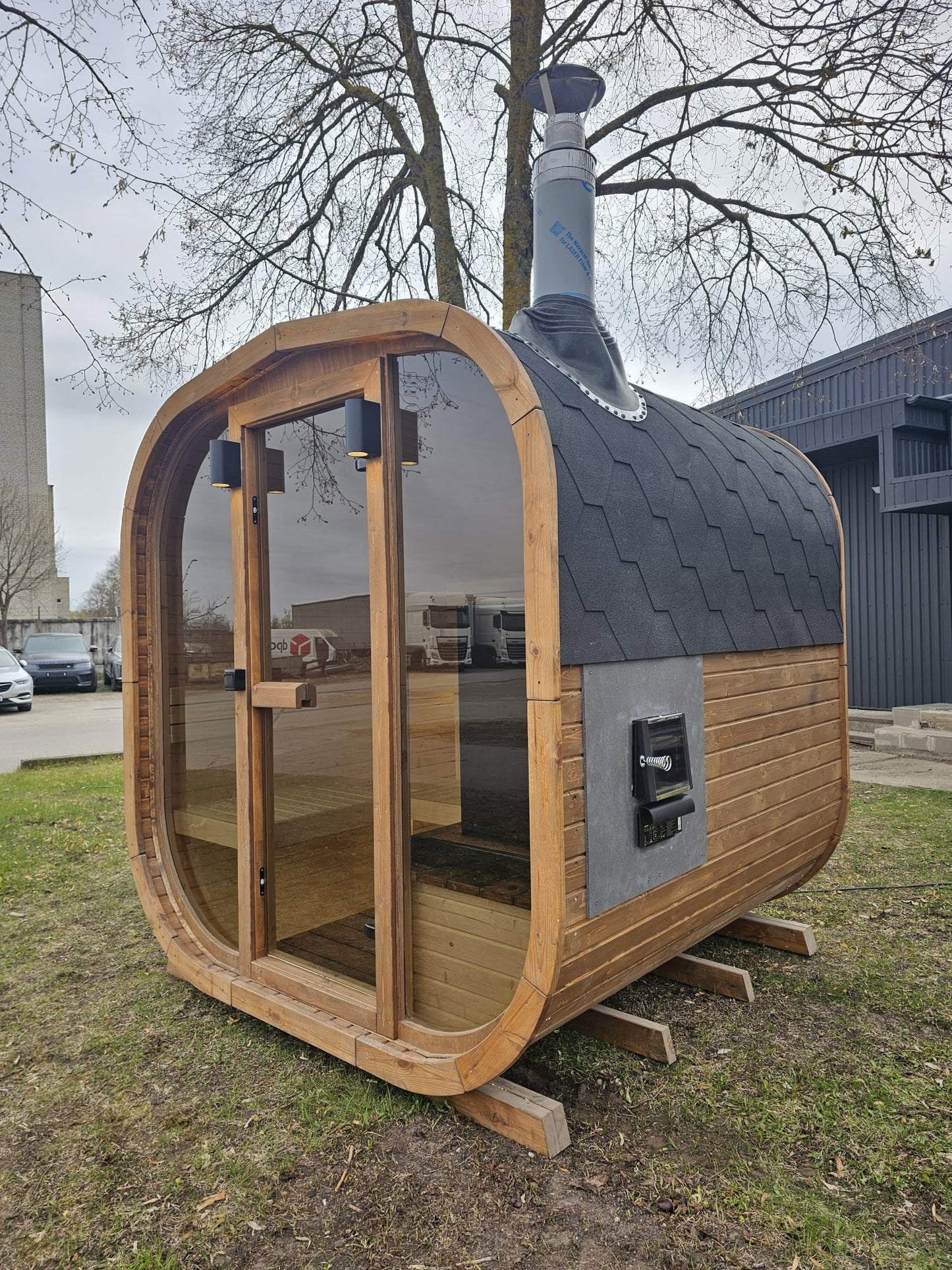 Cube Sauna 2m rear three-quarter view with chimney flue and through-wall heater hatch
