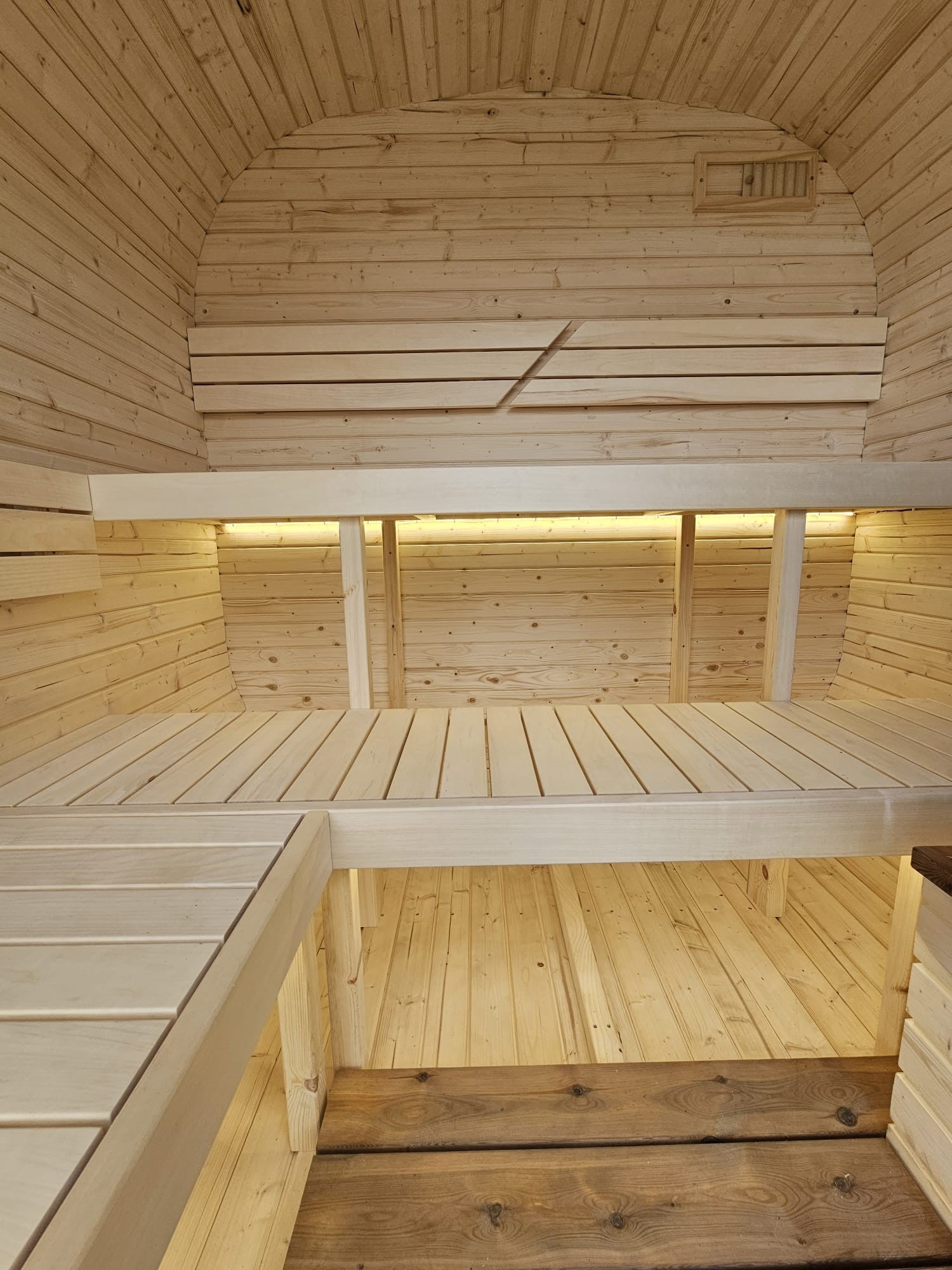 Cube Sauna 2m interior showing upper and lower bench levels with LED strip lighting