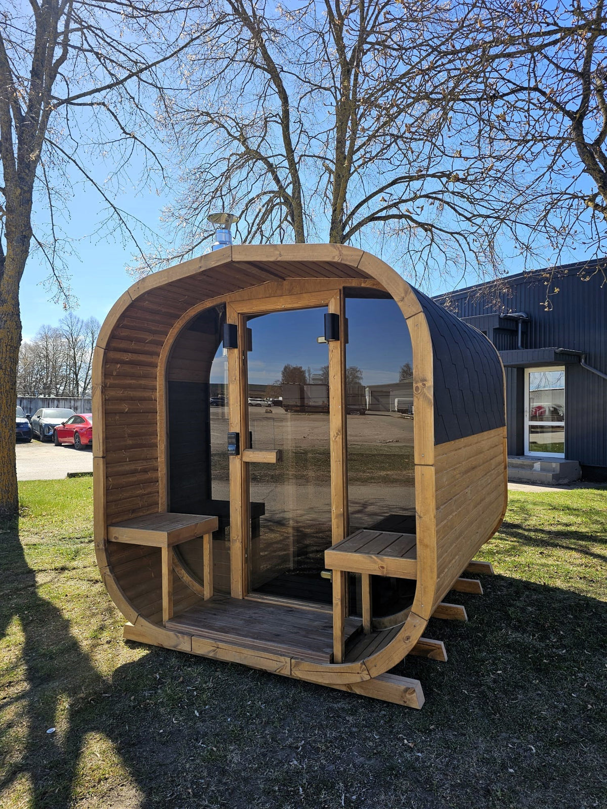 Cube Sauna 2m with open door and front bench seating on the entrance deck
