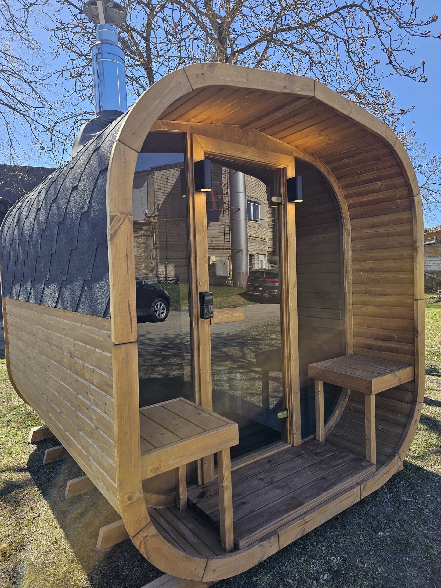 Cube Sauna 2m open glass door showing the interior benches from outside