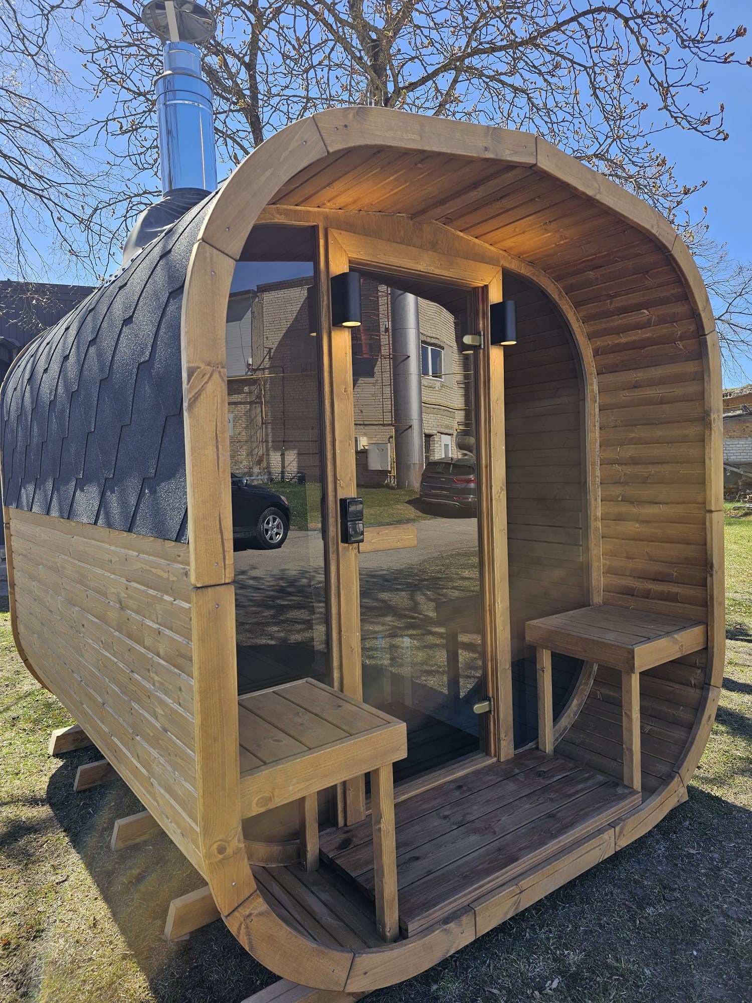 Cube Sauna 2m open glass door showing the interior benches from outside