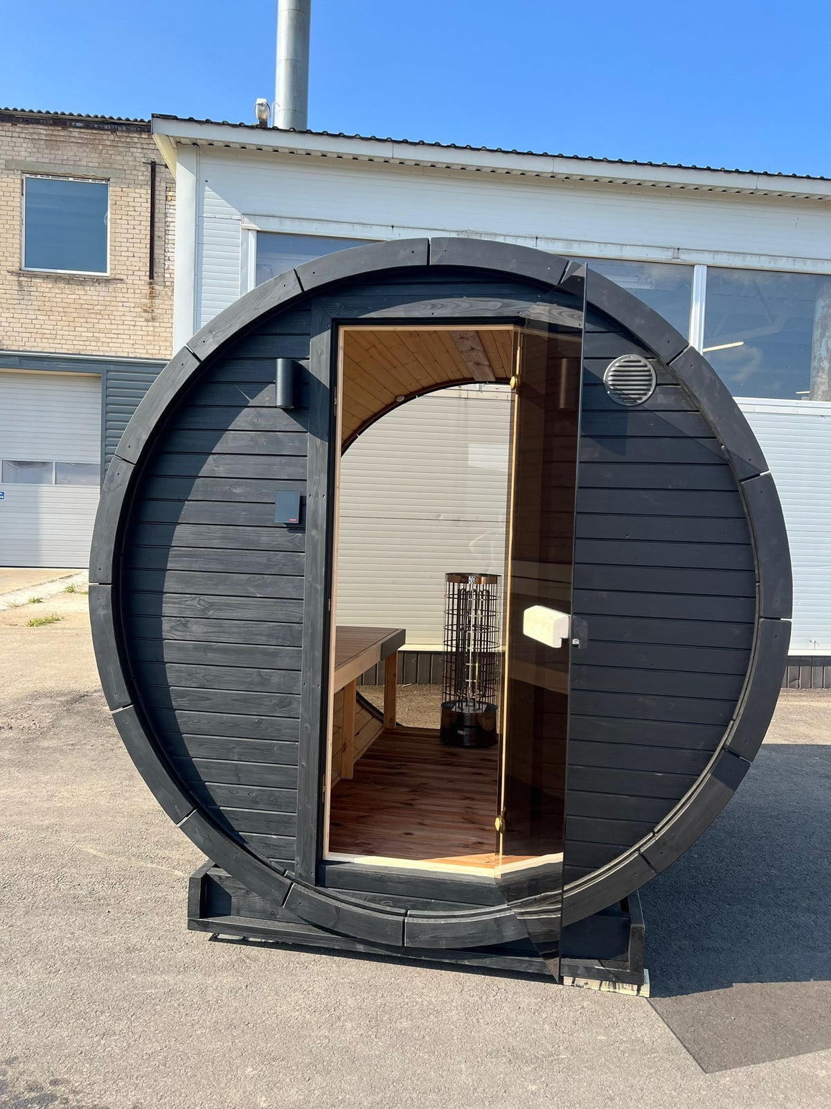 Hiili 2m black barrel sauna front elevation with glazed door