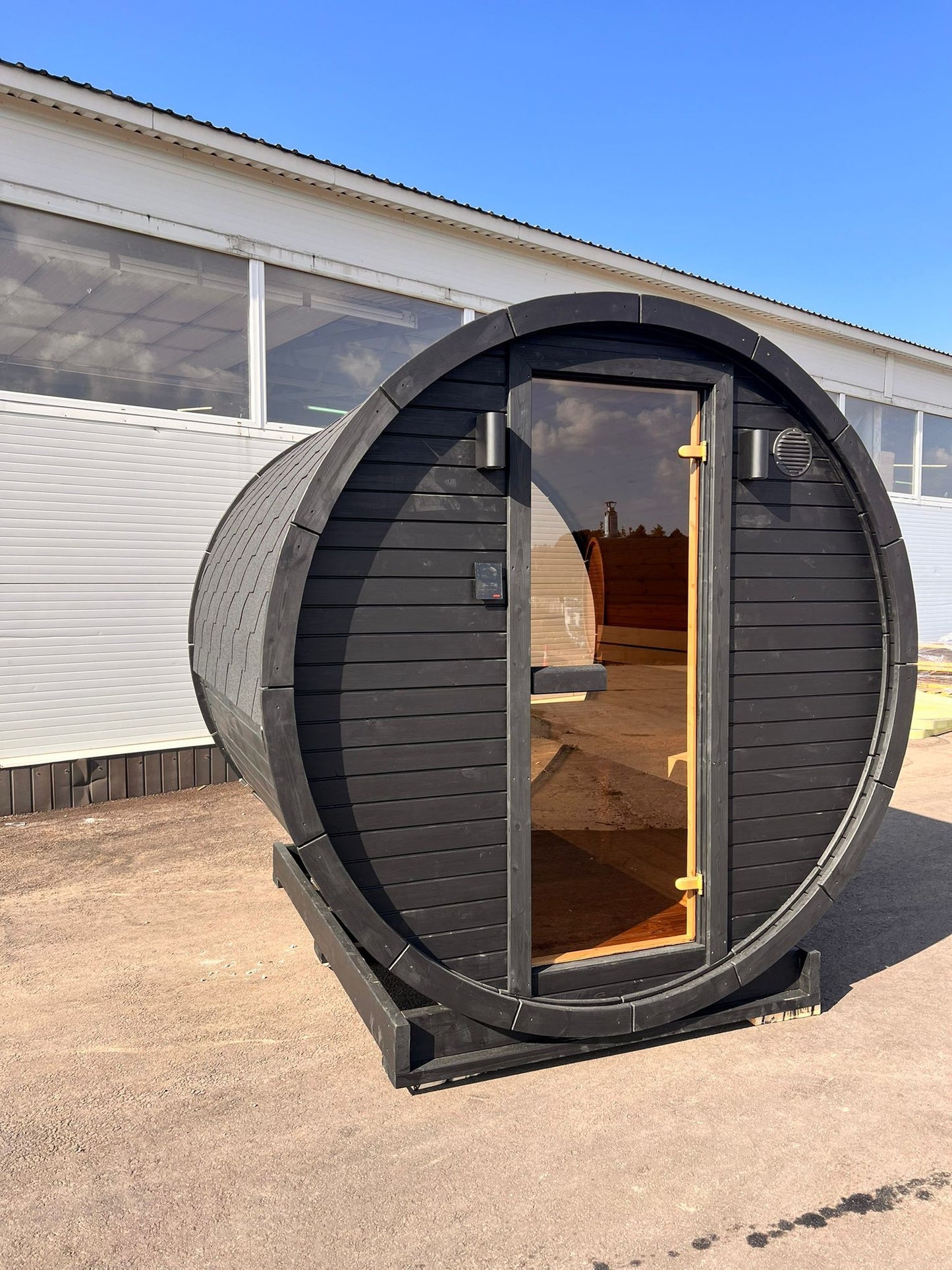 Hiili 2m black barrel sauna exterior showing Coal Black finish and door
