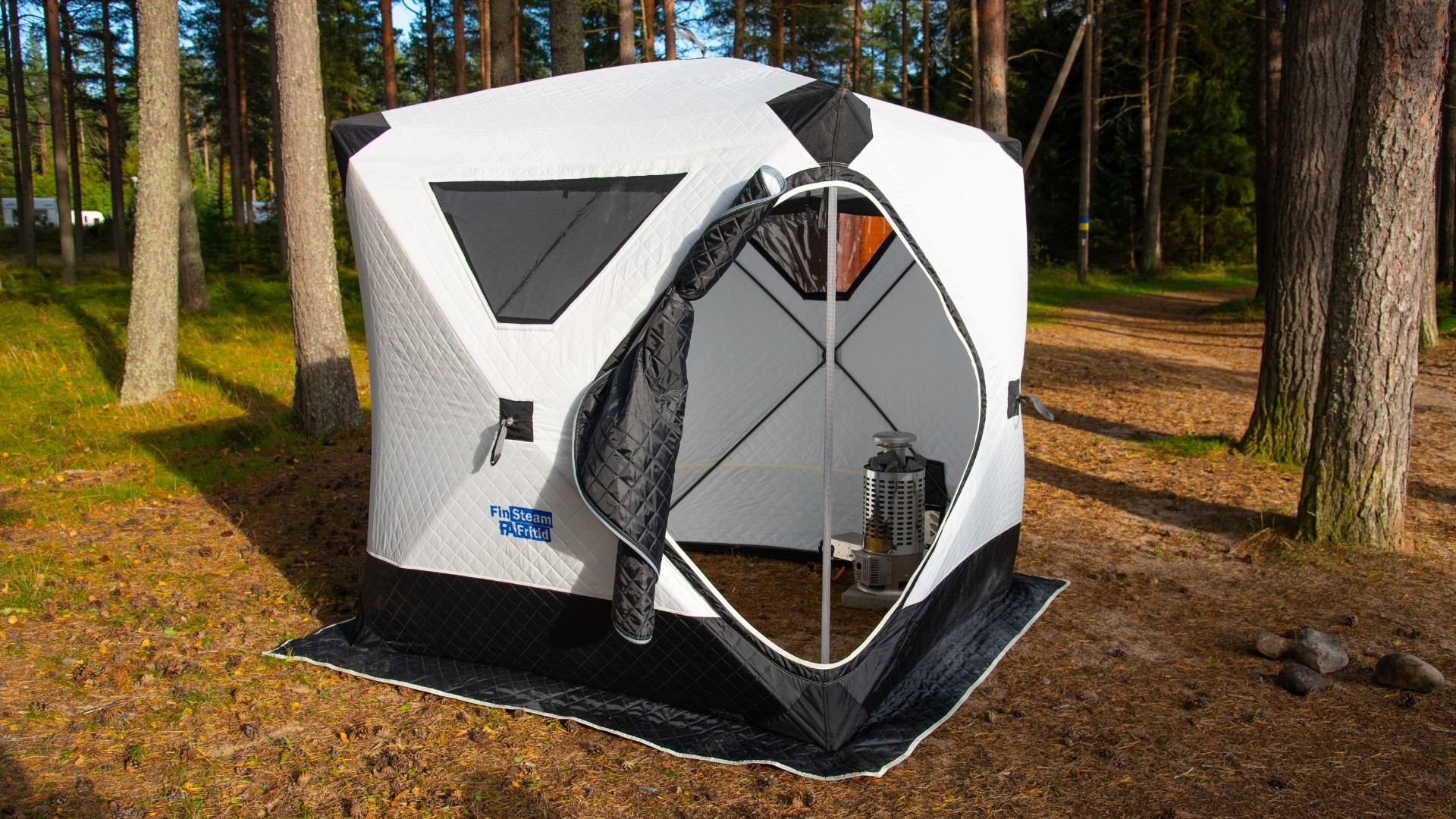 finsteam-botnia-81-listed-with-fritid-tent-in-forest-lifestyle