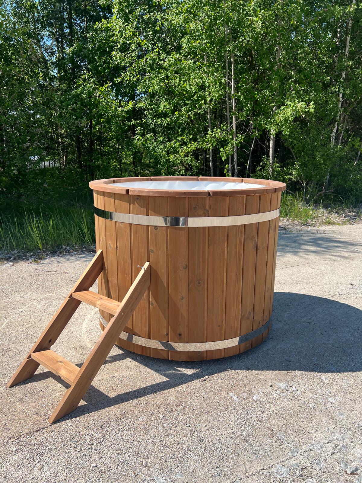 Halla 120 barrel cold plunge tub installed in a garden