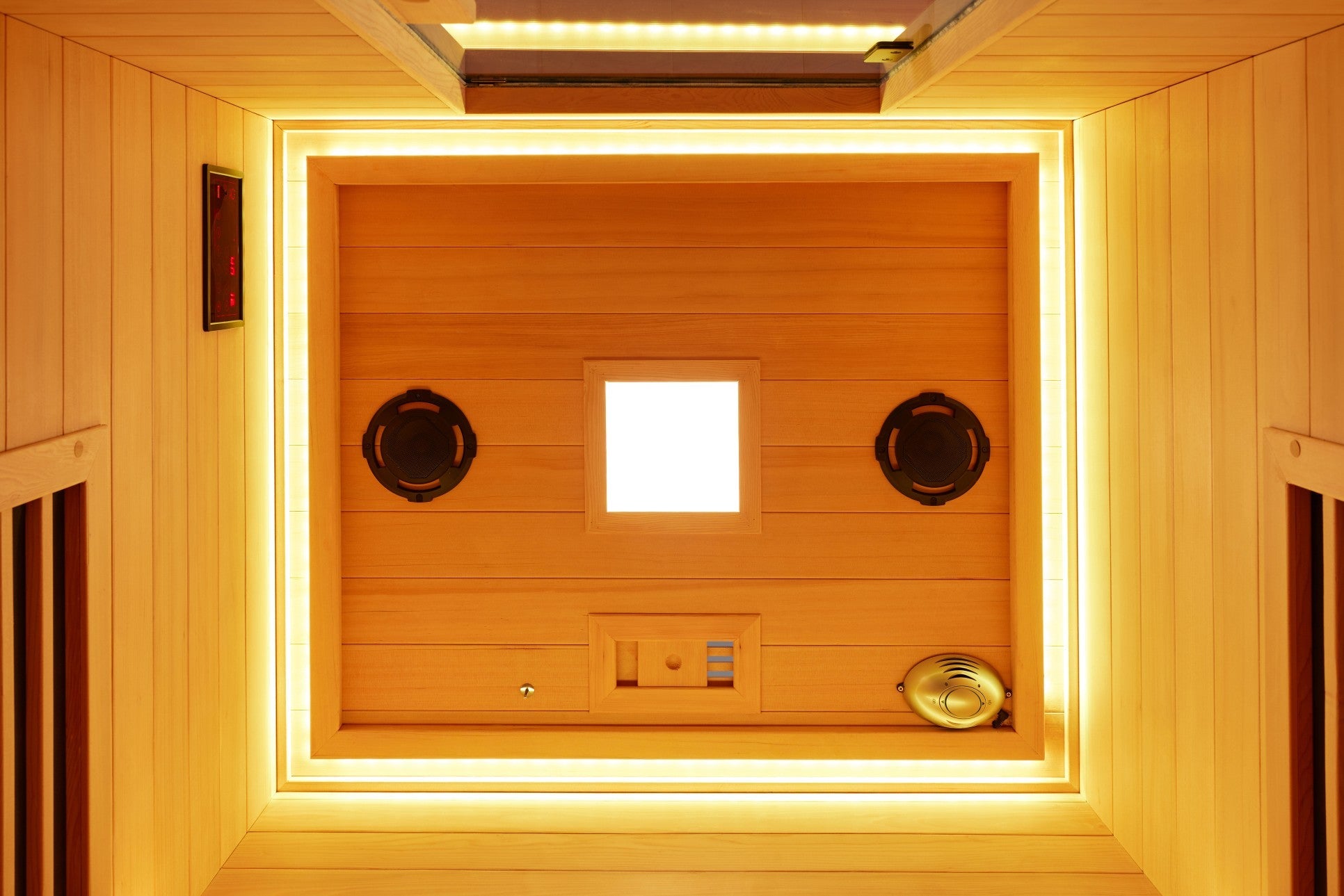Ceiling of the two-person infrared sauna showing the twin speakers, light panel, digital control display and ventilation grille