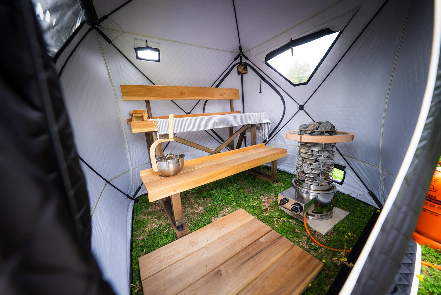 People enjoying a FinSteam portable gas sauna outdoors