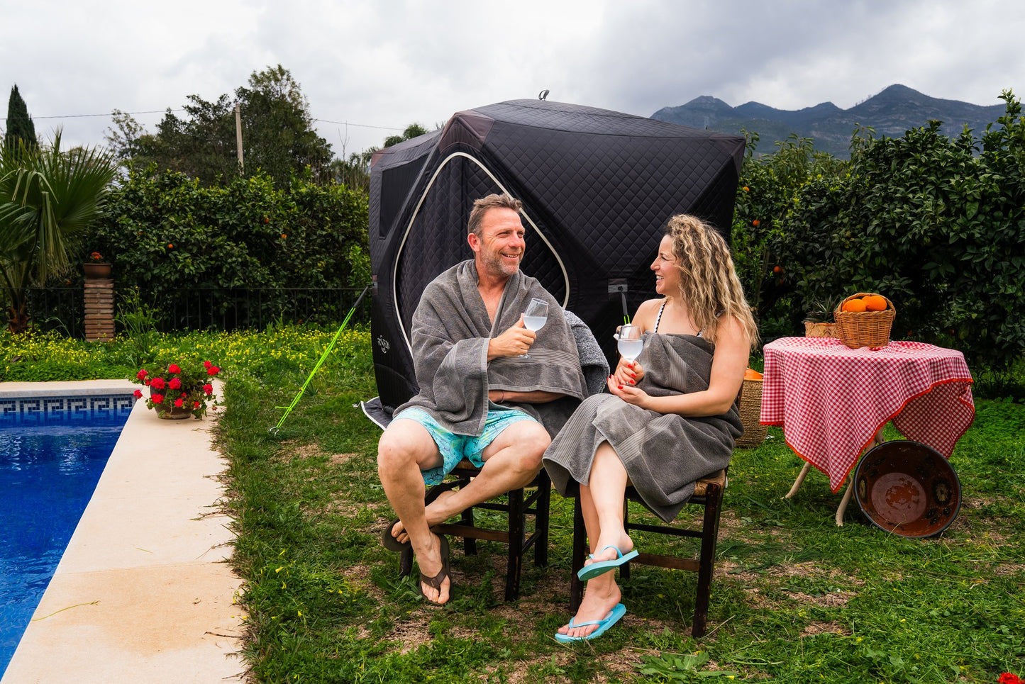 People enjoying a FinSteam portable gas sauna outdoors
