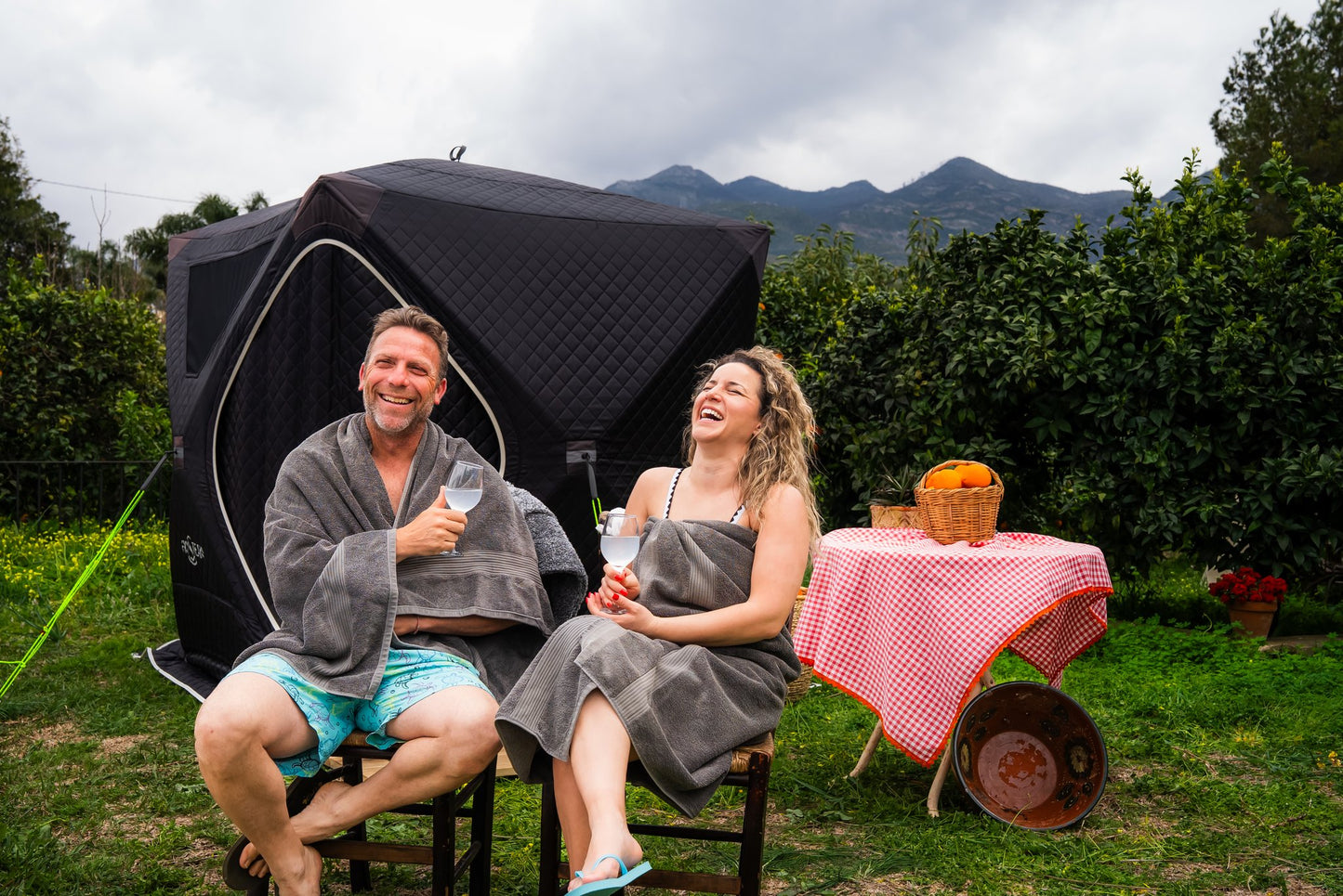 People enjoying a FinSteam portable gas sauna outdoors