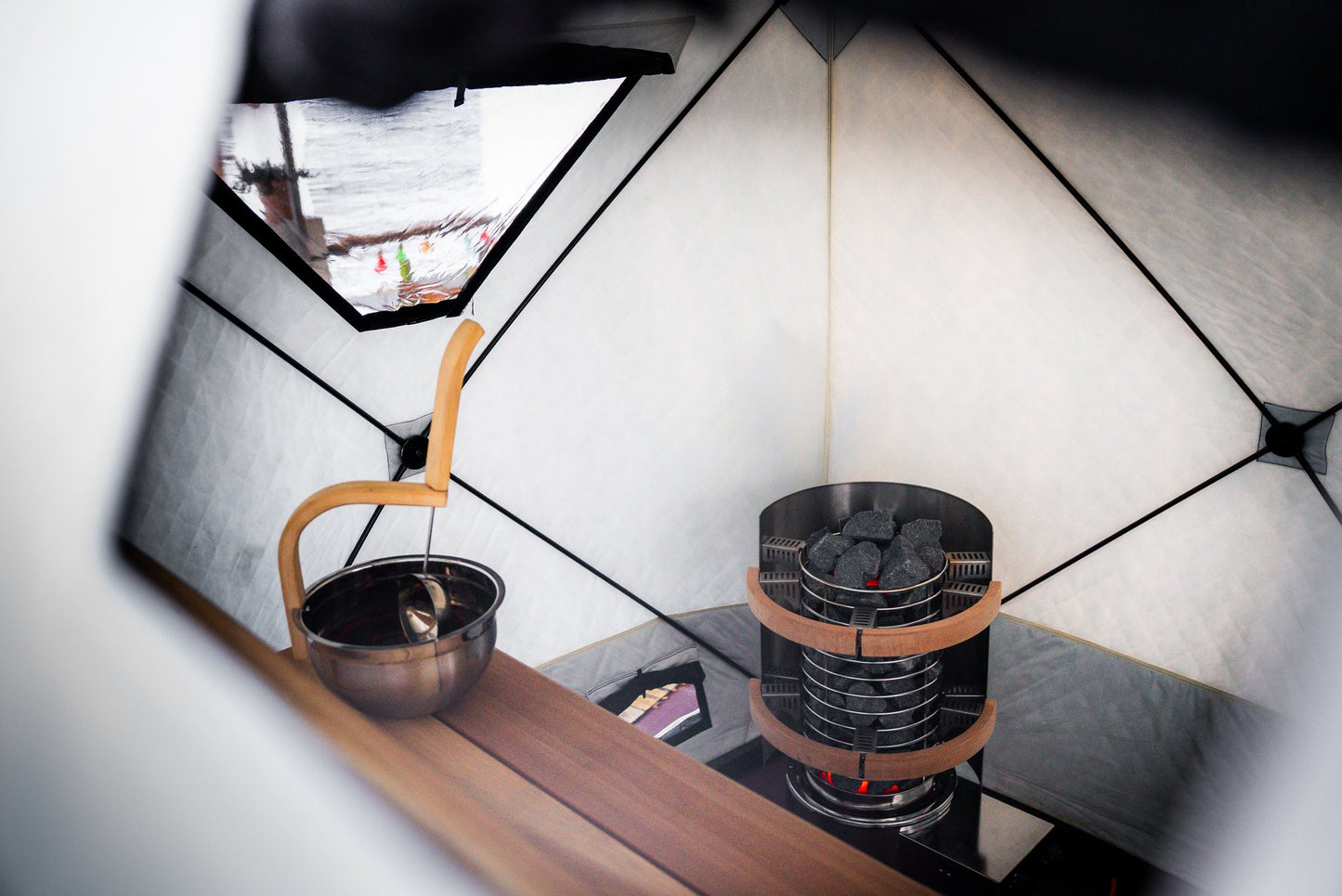 People enjoying a FinSteam portable gas sauna outdoors
