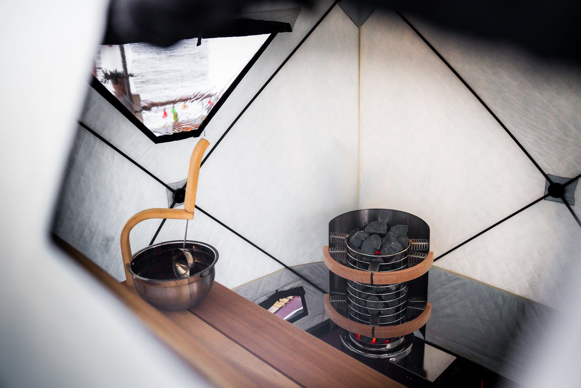 People enjoying a FinSteam portable gas sauna outdoors