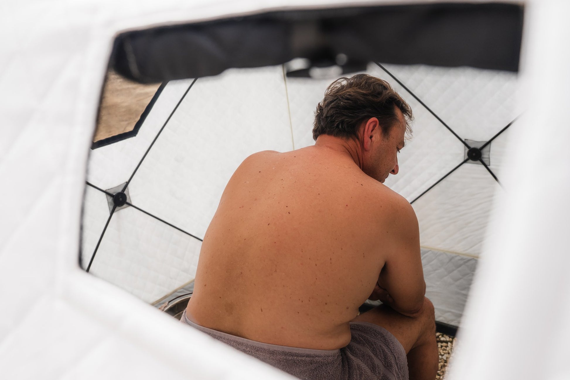 People enjoying a FinSteam portable gas sauna outdoors