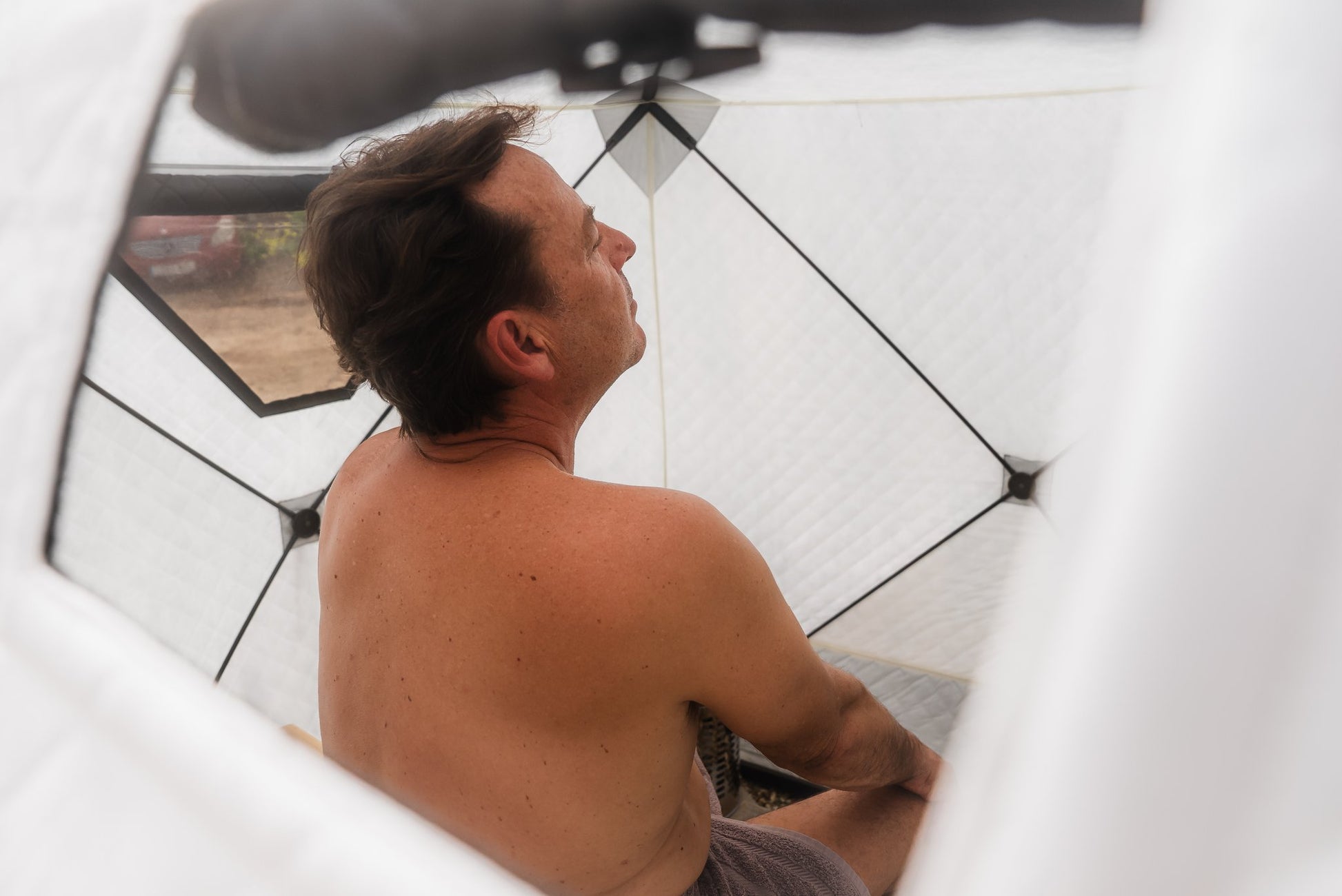 People enjoying a FinSteam portable gas sauna outdoors