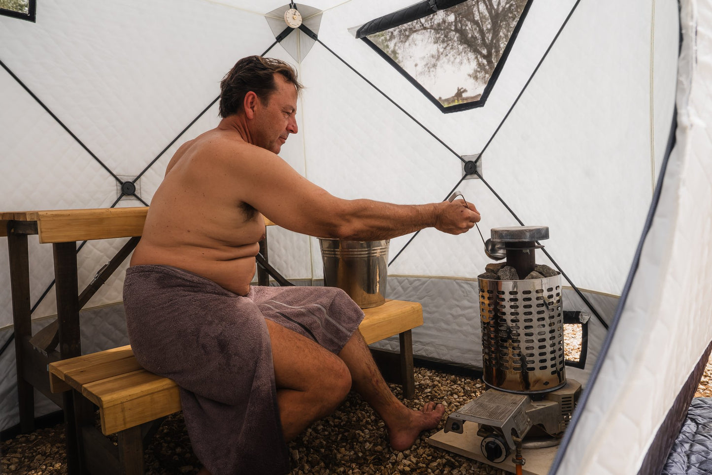 People enjoying a FinSteam portable gas sauna outdoors