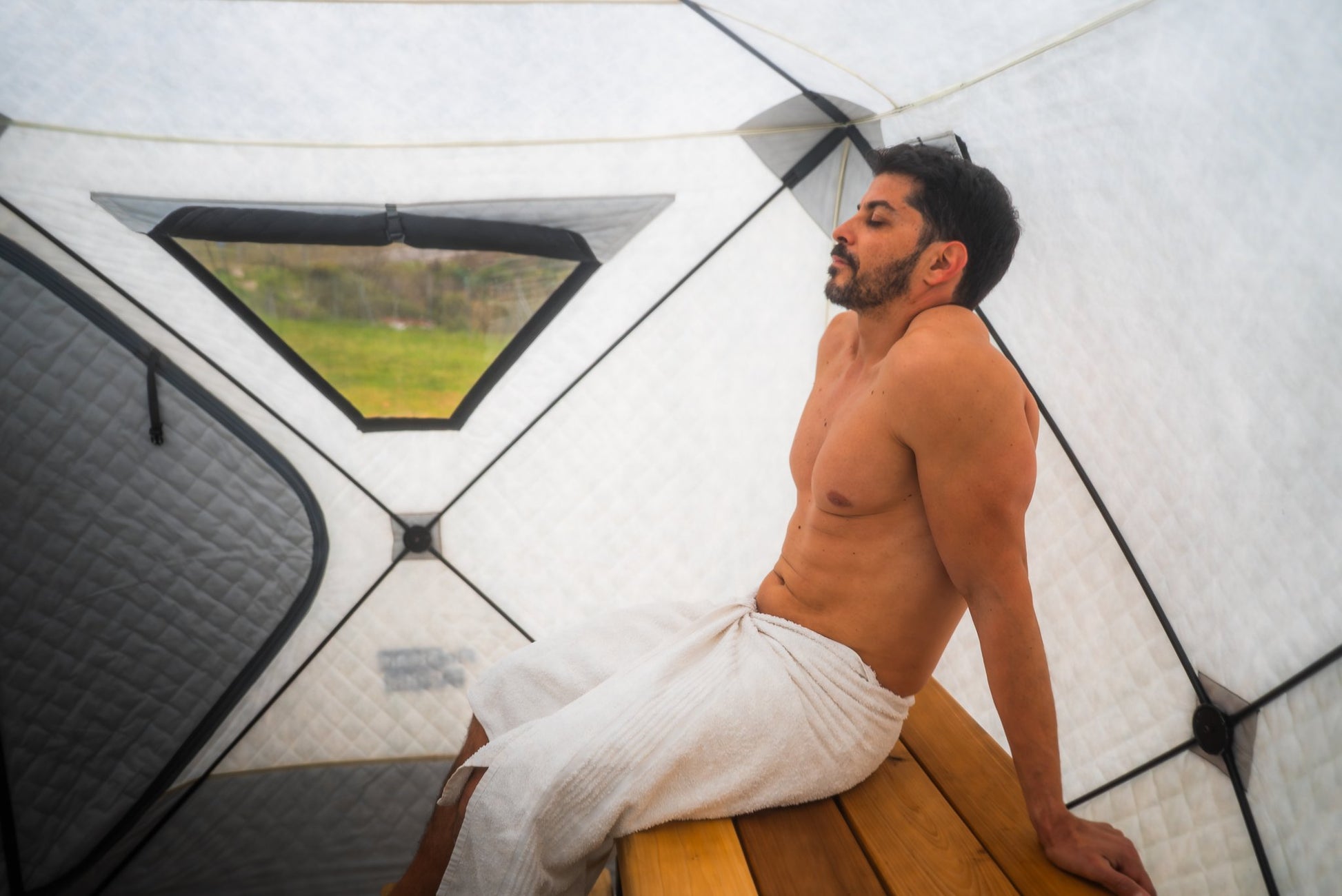 People enjoying a FinSteam portable gas sauna outdoors