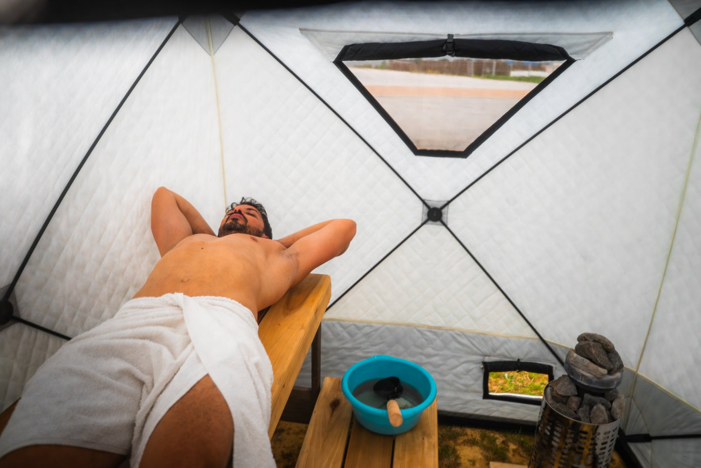People enjoying a FinSteam portable gas sauna outdoors