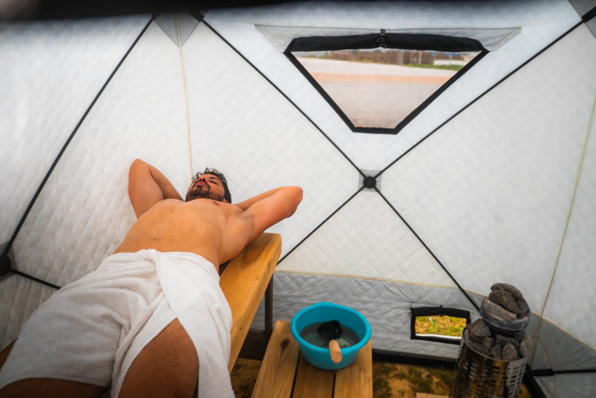 People enjoying a FinSteam portable gas sauna outdoors