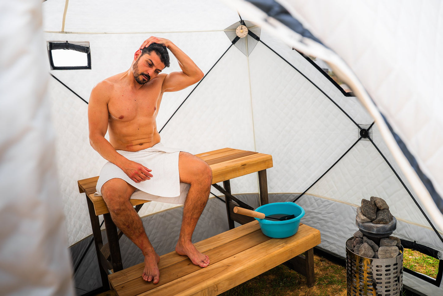People enjoying a FinSteam portable gas sauna outdoors