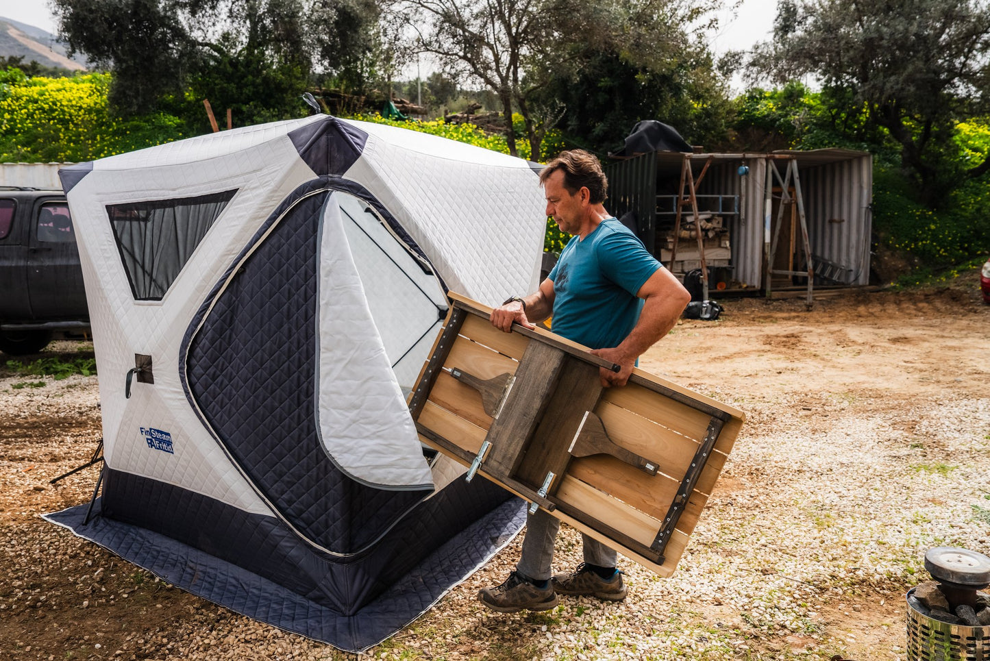 People enjoying a FinSteam portable gas sauna outdoors