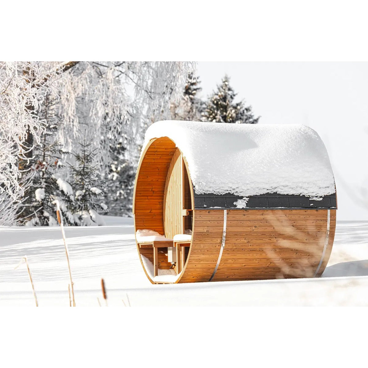 Hekla Barrel Sauna 210 outdoor barrel sauna in snowy setting (lifestyle image).