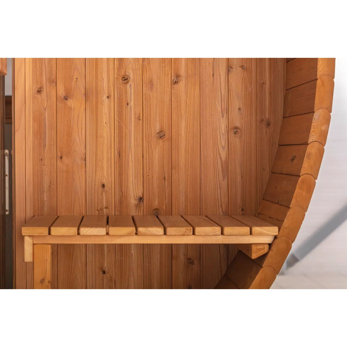 Close-up of interior bench seating inside the Hekla Barrel Sauna 210.