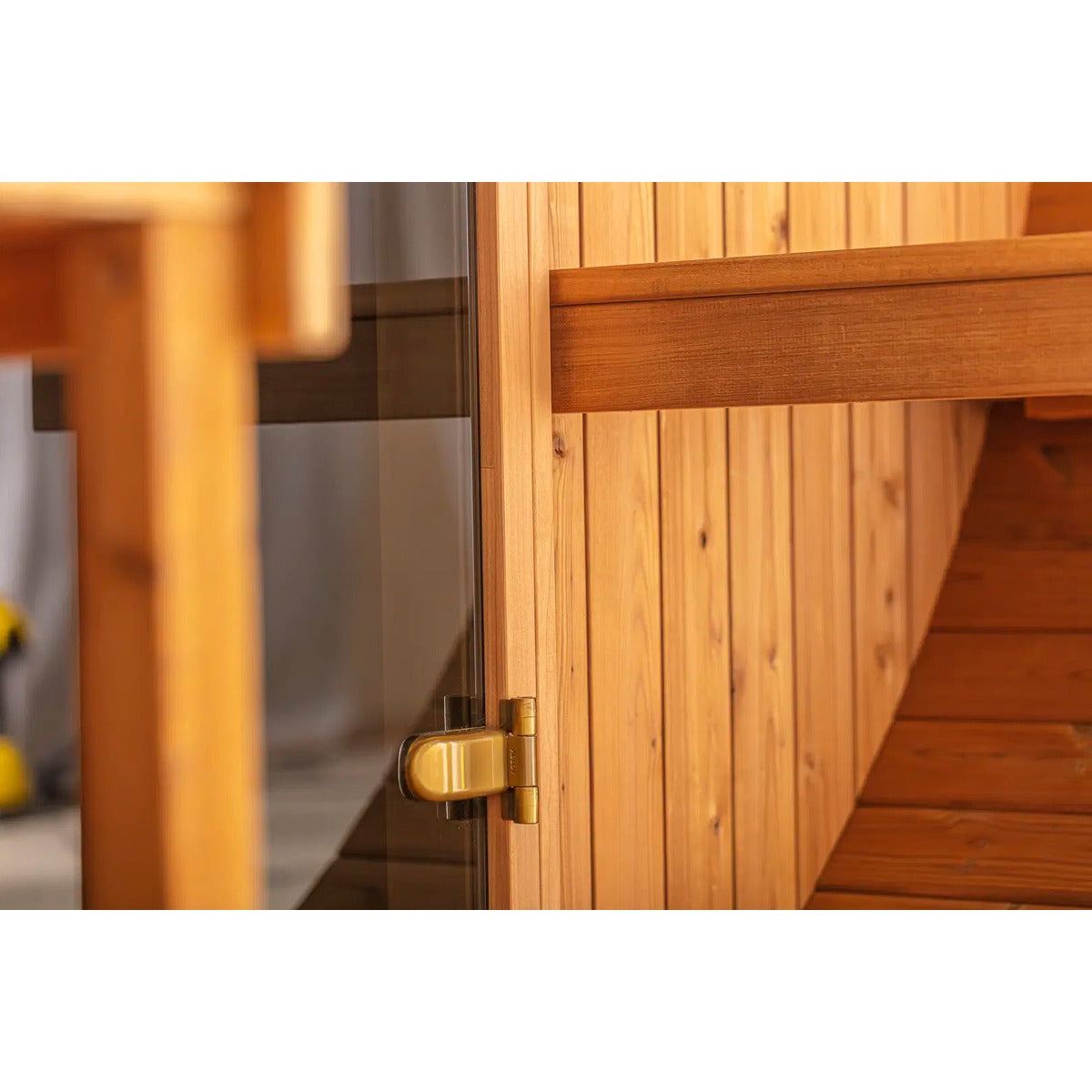 Close-up of the Hekla Barrel Sauna 250 door hinge detail.