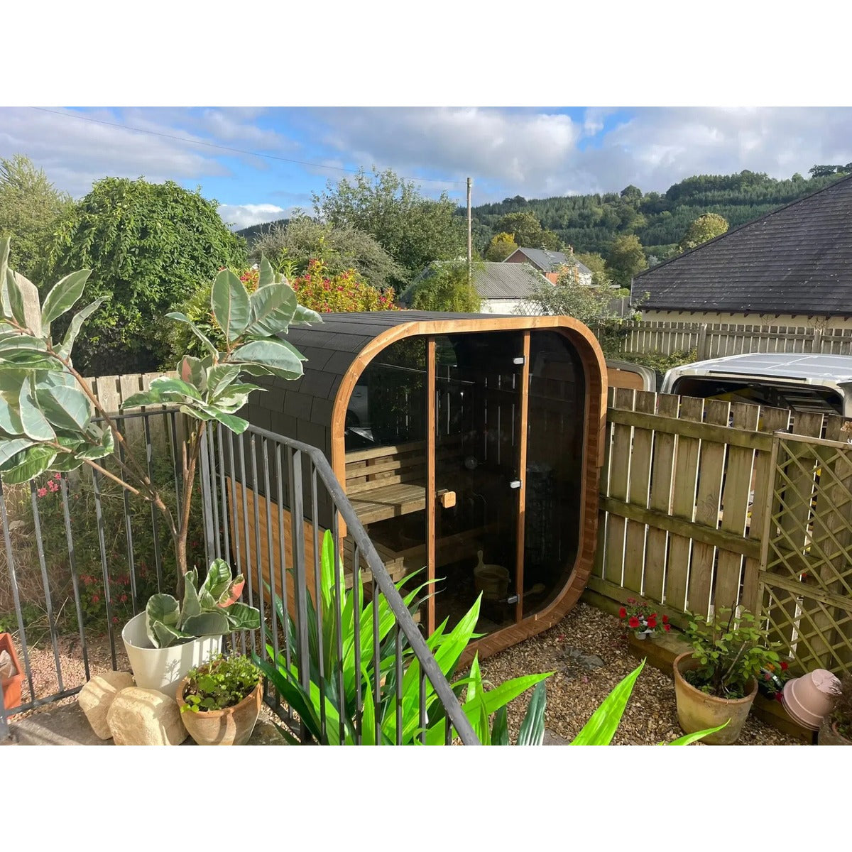 Hekla Cube Sauna 160 outdoor cube sauna, lifestyle garden deck installed.