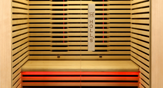Holl's Canopée 2 two person infrared sauna with full-height glazing and horizontal slatted interior