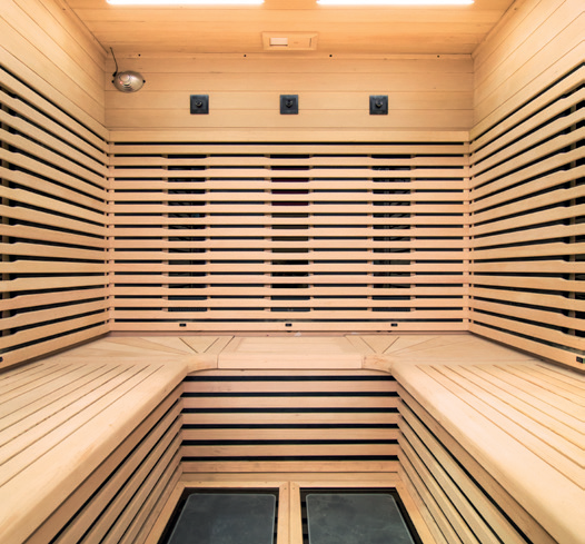 Holl's Canopée 2 two person infrared sauna with full-height glazing and horizontal slatted interior