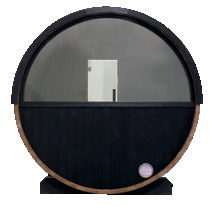 Holl's Onyxia Barrel black ThermoWood barrel sauna with chimney on a stone patio