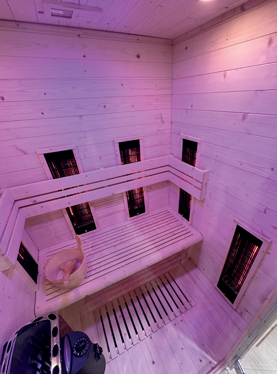 Holl's Symbioz Hybrid sauna in black with visible infrared emitters and steam heater