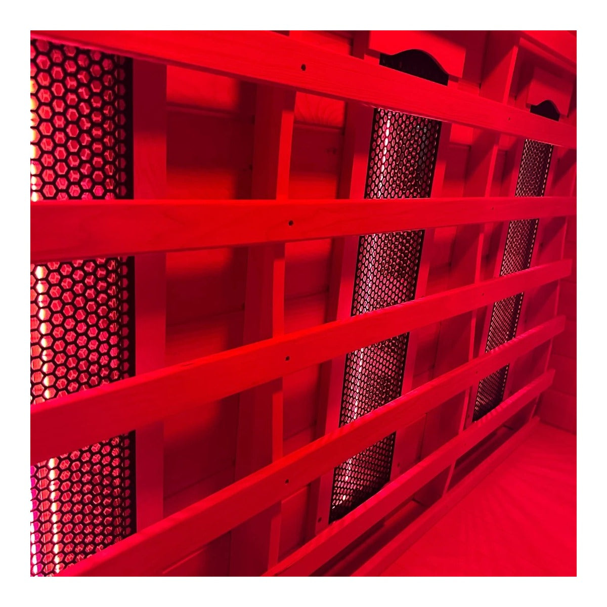 Steam & Oak Kajo 1 full spectrum infrared sauna — heater wall lit red, angled view