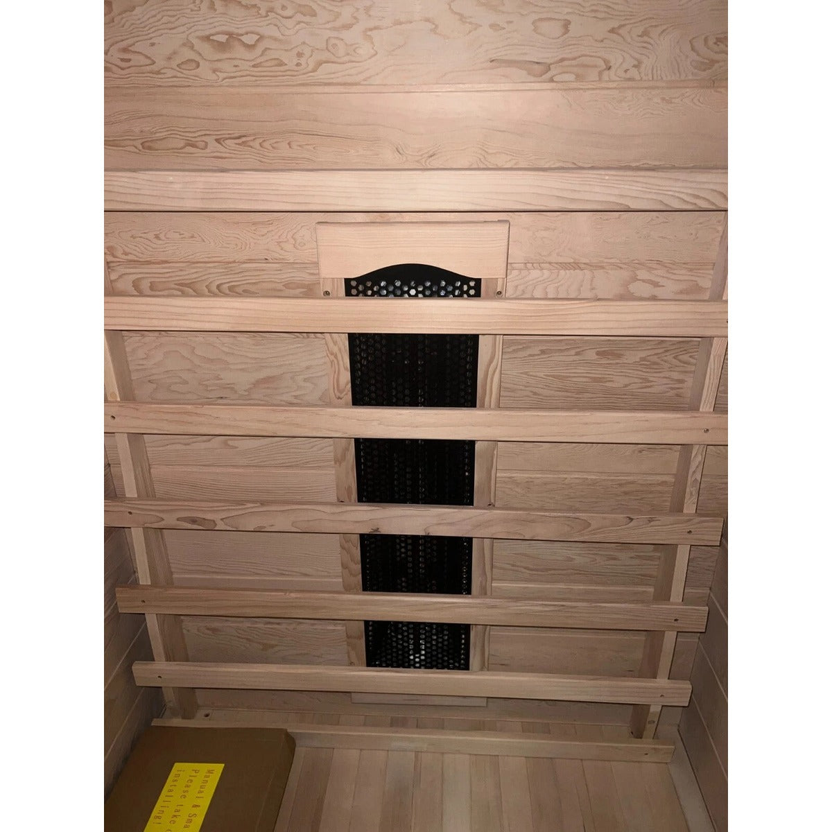 Steam & Oak Kajo 3 full spectrum infrared sauna — rear heater wall, lights off, manual box on floor