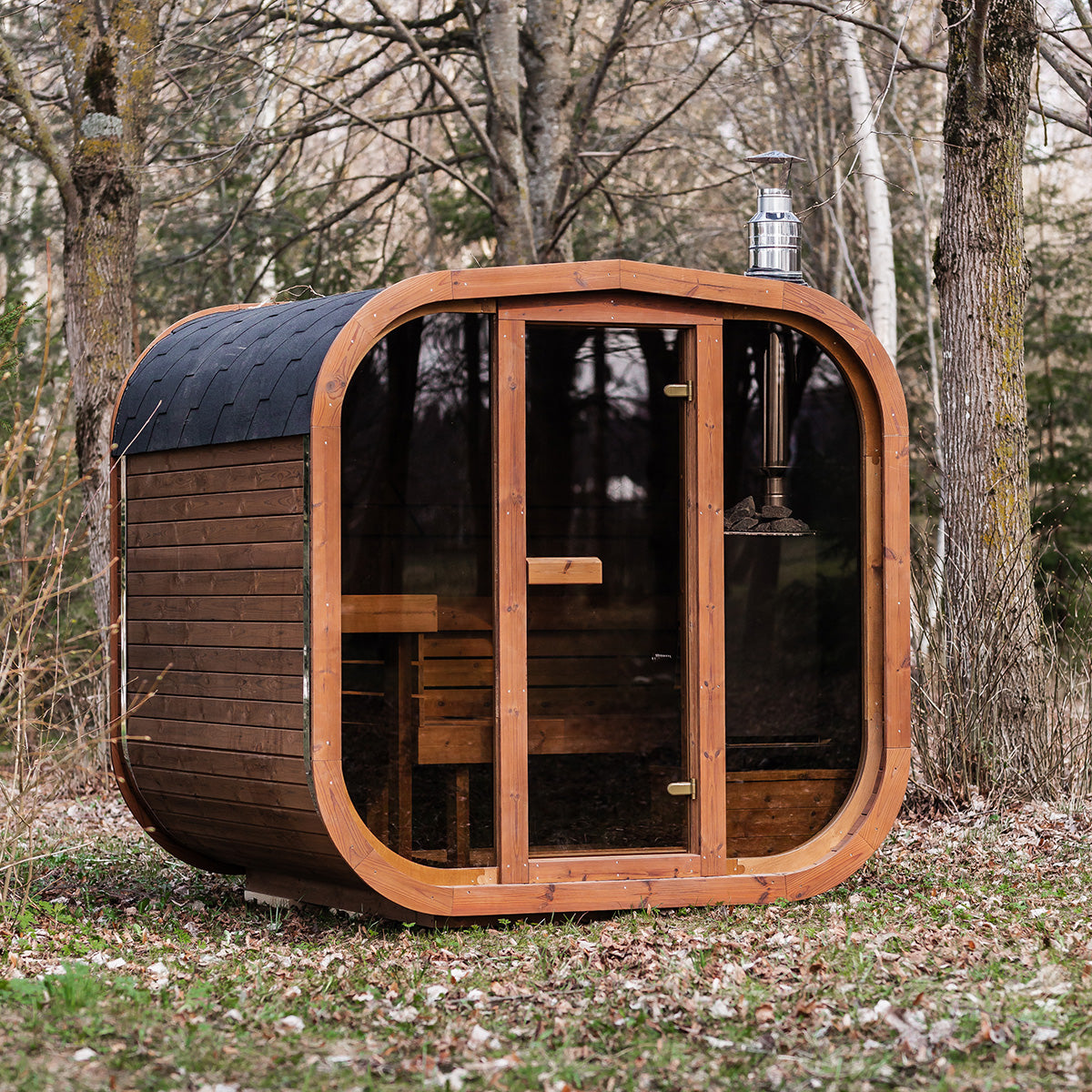 Steam and Oak Ruutu 200 thermowood cube sauna, shown with the optional panoramic front and wood fired heater