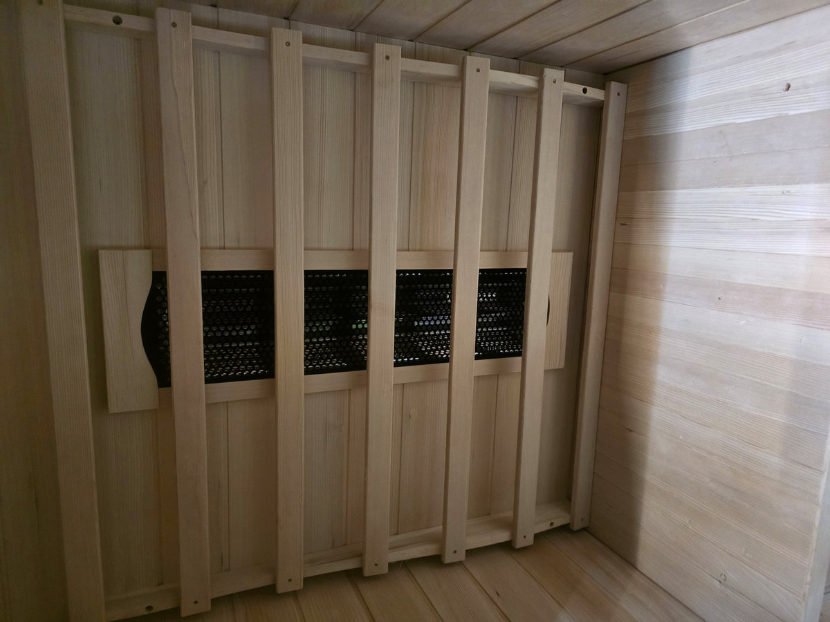 Kajo 1 back-wall infrared heater array behind hemlock slats