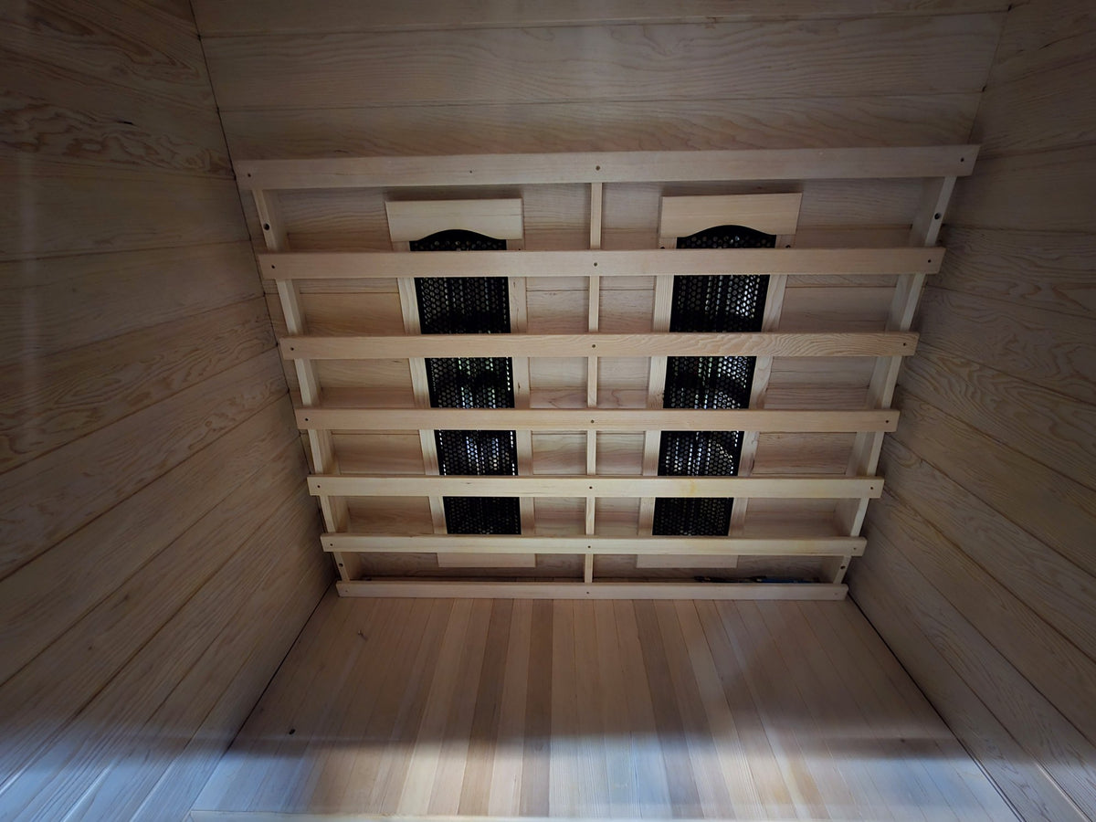 Kajo 2 hemlock bench above floor-level infrared heaters