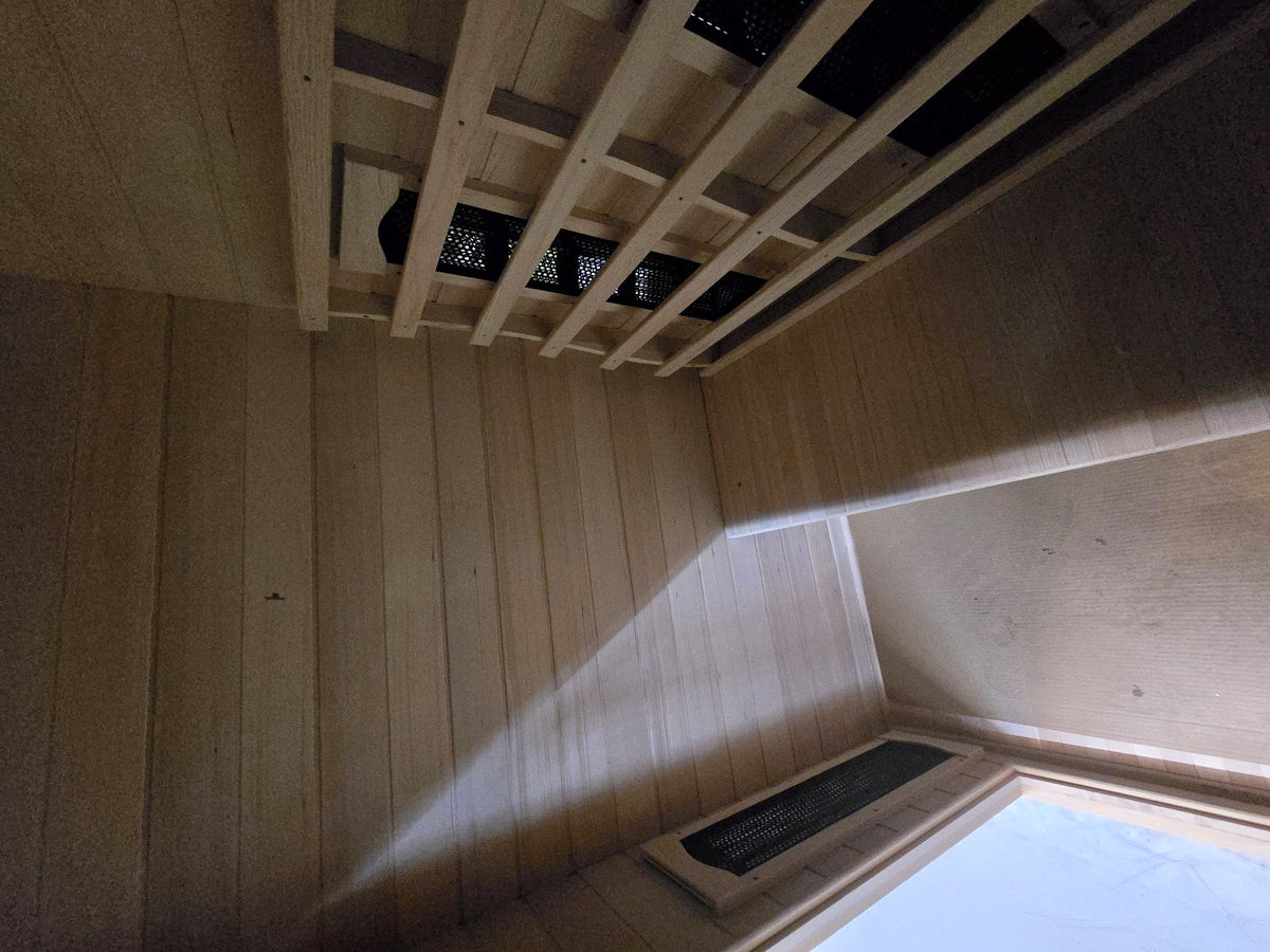 Inside the Kajo 3 — full-width hemlock bench and infrared heaters