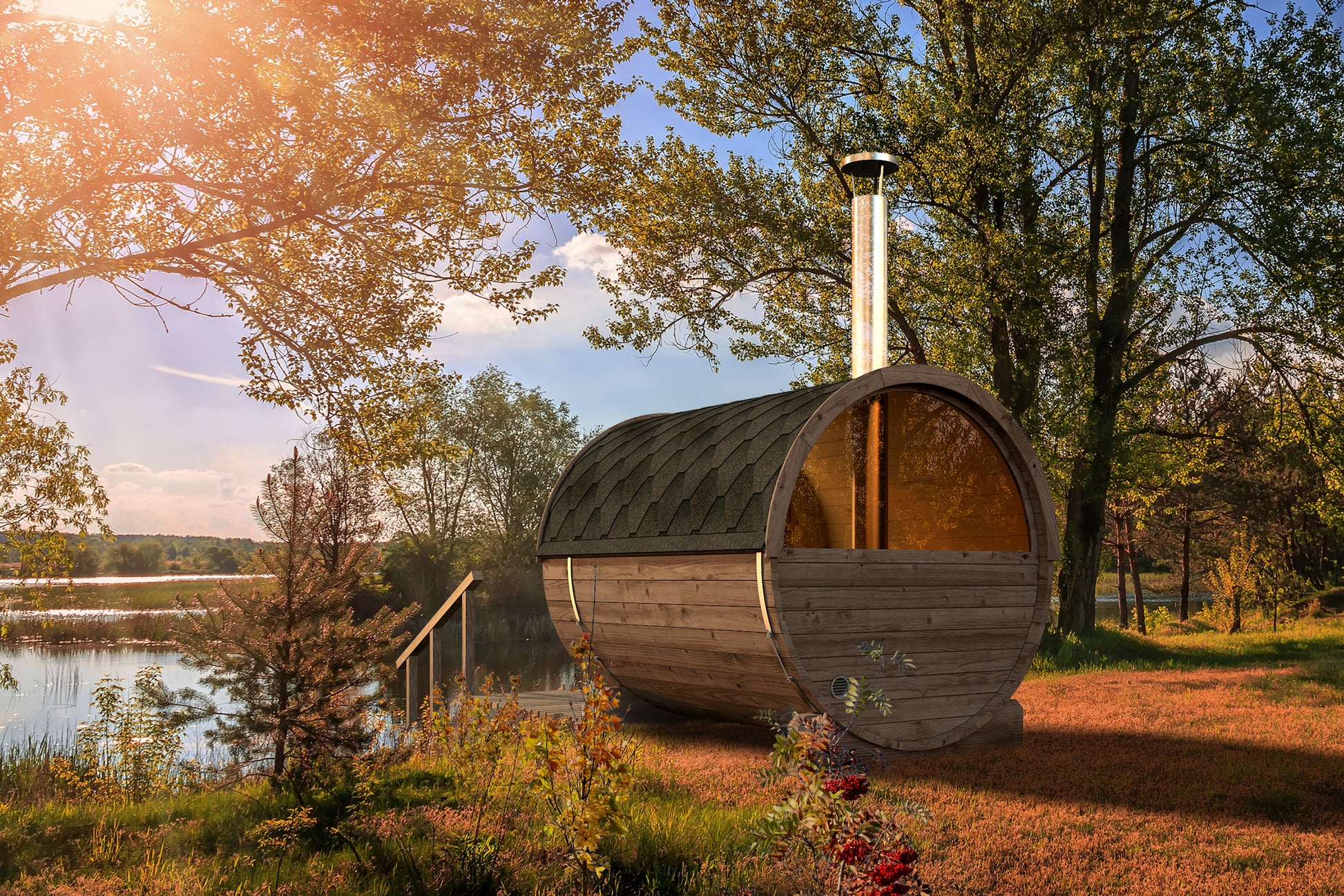 Saaren 250 barrel sauna beside a lake with wood-fired chimney