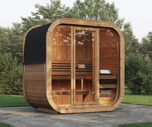 Steam & Oak Solo 205 outdoor sauna on a stone patio, thermowood cabin with full glass front and black shingle roof