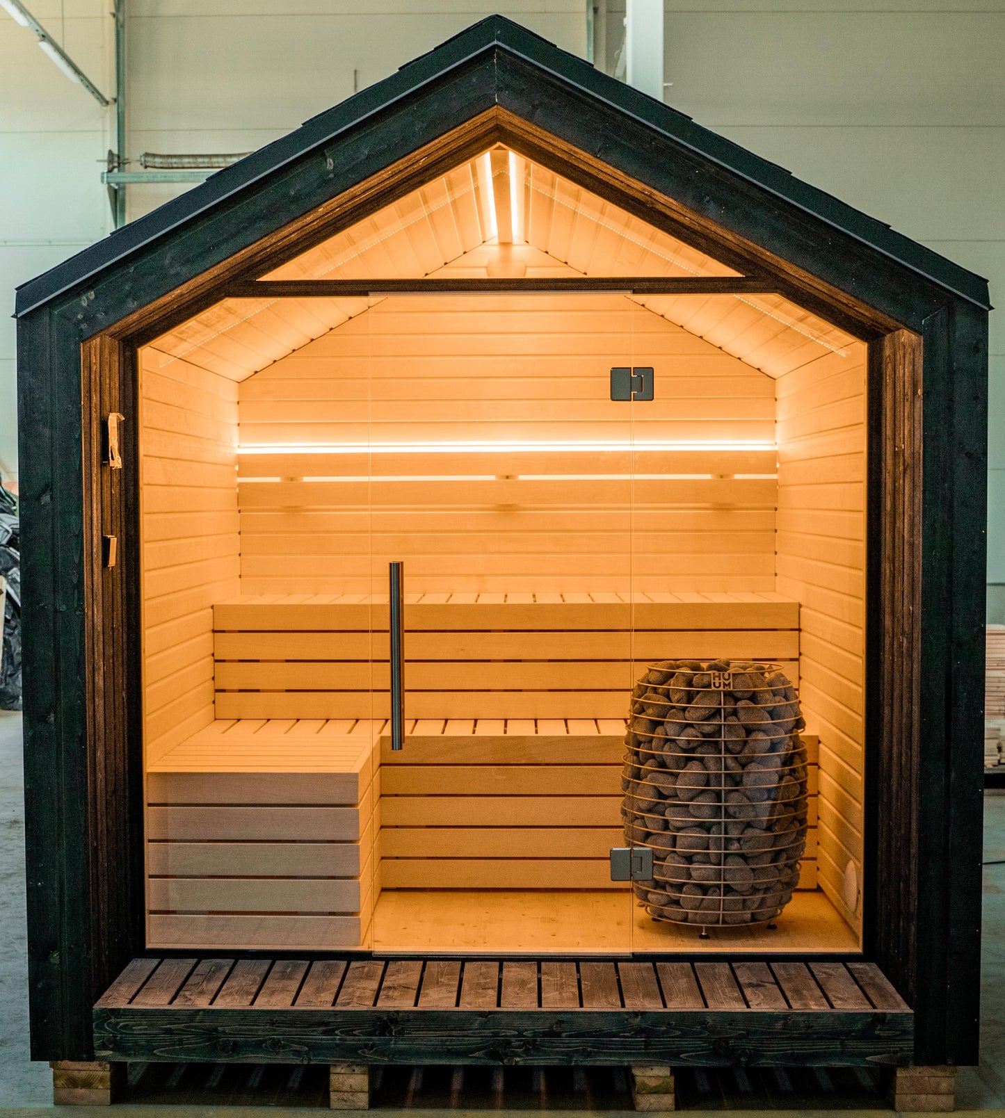 Steam & Oak Tartu pre-assembled sauna house, blackened spruce with full glass gable and aspen interior, view 1